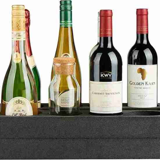 A selection of four wine bottles, including sparkling, white, and red wines neatly arranged in a Foam 8 Bottle Holder.