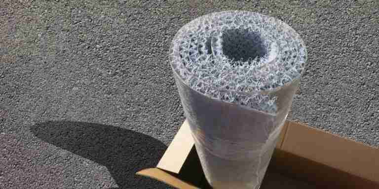 An artistic rendering of a cylindrical object with a complex, sponge-like structure on a flat surface, designed how to stop the cause of damp and mildew under bed mattress, casting a long shadow. How to Stop Cause of Damp and Mildew Under Bed Mattress